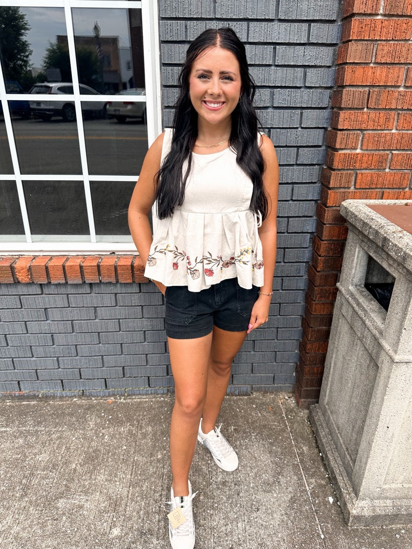 Embriodered Sleeveless Peplum Top
